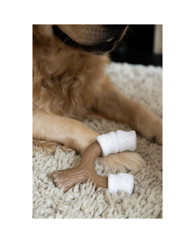 Nylabone dog chew toy in peanut butter flavor, brown color, large size, designed for dogs to chew and play.