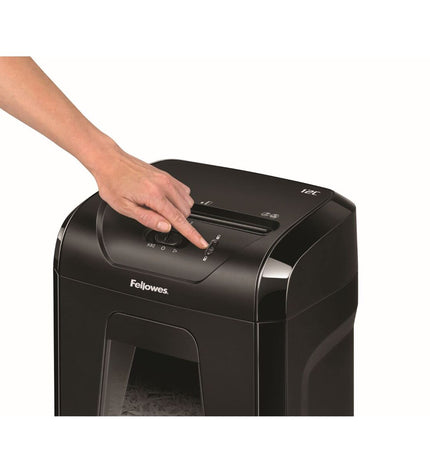 Fellowes Powershred 12C paper shredder with 19-liter bin, used for office paper disposal, in a typical office setting