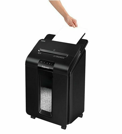 Fellowes AutoMax 100M paper shredder microsnippers in black for secure document destruction, shown with paper in action.