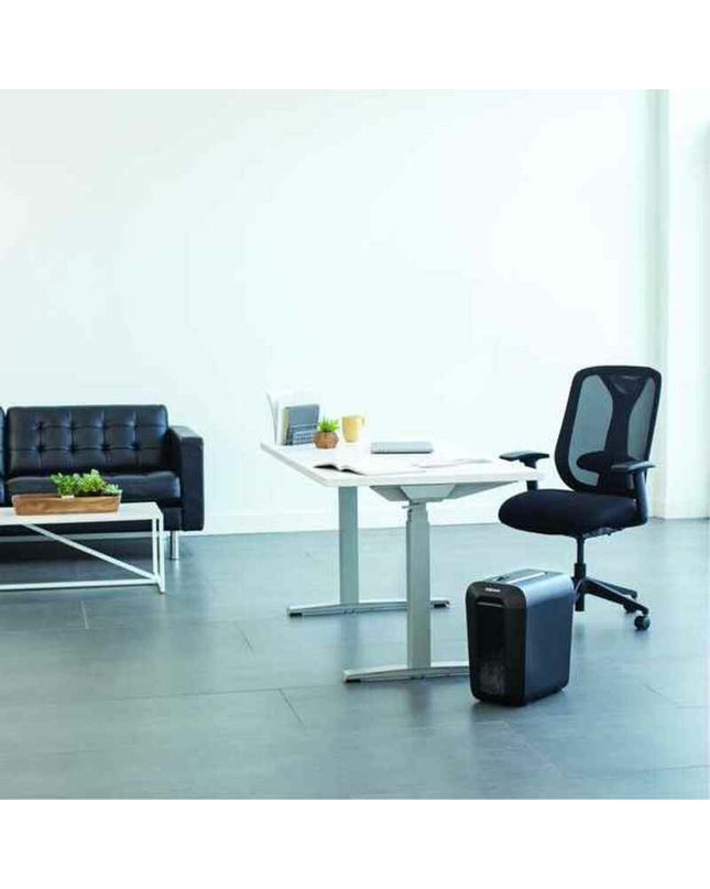 Fellowes LX65 paper shredder in black with 22-liter capacity, shown with shredded paper and cutting blades.