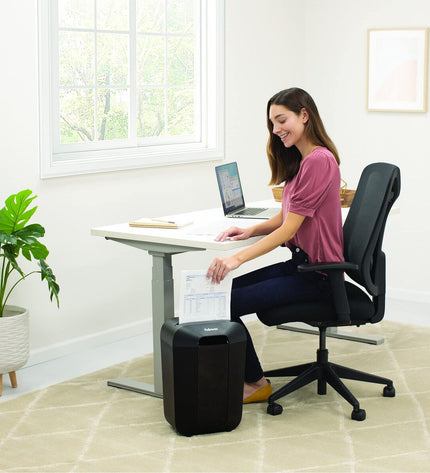 Fellowes Powershred LX70 paper shredder for office use, featuring a compact design and cutting mechanism for secure document disposal