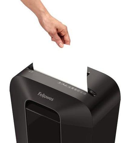 Fellowes Powershred LX70 paper shredder for office use, shown on a desk with shredded paper nearby.