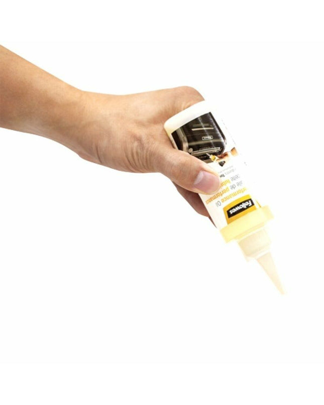 Fellowes paper shredder oil in a plastic bottle, used for maintaining office paper shredder performance.