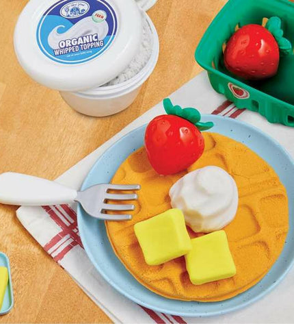 MGA Eten speelgoedset with plastic food items for pretend play, including fruits, vegetables, and kitchen accessories.