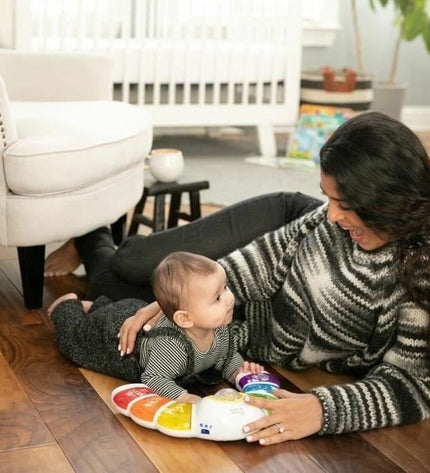 Baby Einstein Glow & Discover Light Bar, colorful interactive baby piano with light-up keys for young children, educational toy.