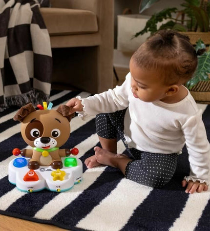 Baby Einstein Ocean musical toy for babies, showing colorful ocean-themed design with interactive features on a soft surface.