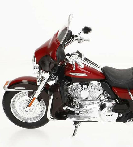 Detailed 1:12 scale Harley-Davidson Electra Glide toy motorcycle in black with chrome accents, suitable for play and display.