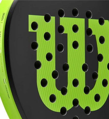 Wilson Blade Junior V2 paddle tennis racket in black, lightweight design with grip and perforated surface for junior sports players.