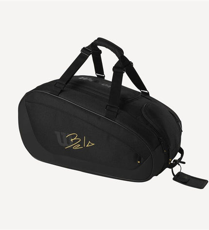 Wilson Bela Super Tour black paddle tennis racket with ergonomic handle and sleek design, suitable for outdoor sports.