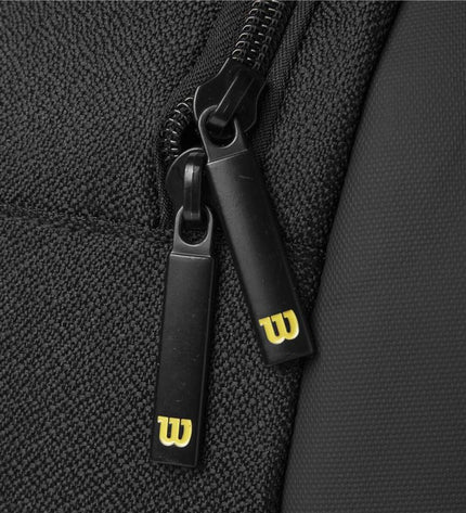 Wilson Bela Super Tour paddle tennis racket in black with ergonomic grip and lightweight design, ideal for competitive play.