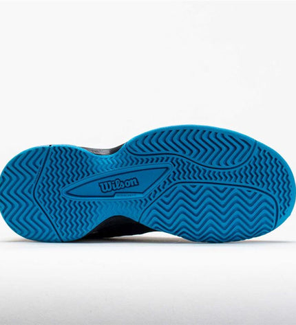 Wilson Rush Pro kids' tennis padelschoenen in zwart, sport outdoor footwear designed for young tennis players.