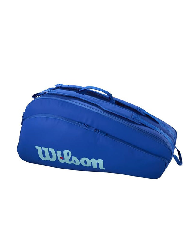 Wilson Ultra V5 Tour tennis rackets 12-pack in blue, lightweight sport gear for outdoor tennis play.