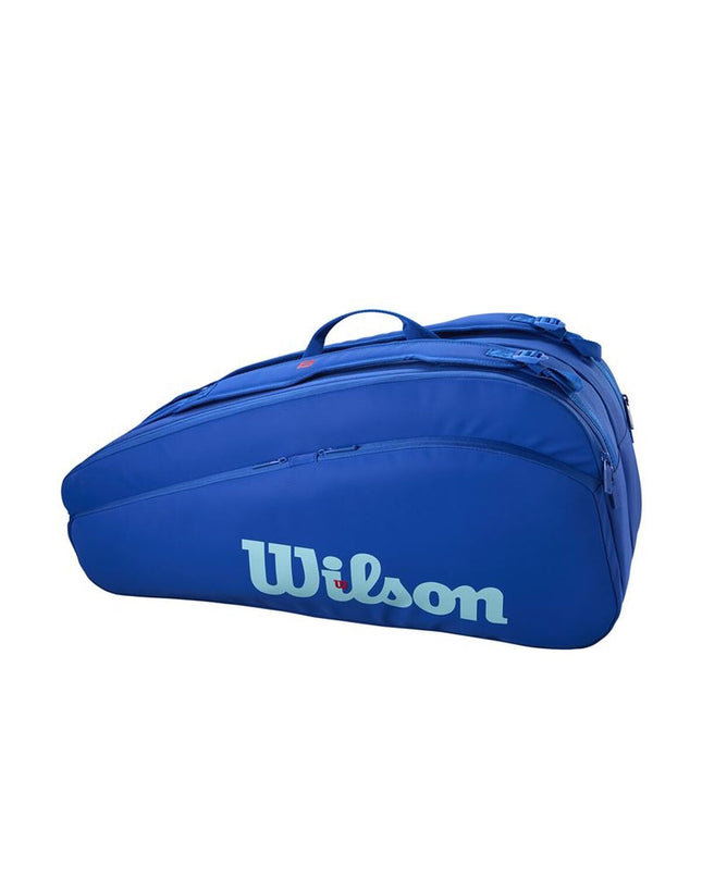 Wilson Ultra V5 Tour tennis racket set with 12 blue rackets, designed for sport and outdoor tennis play.