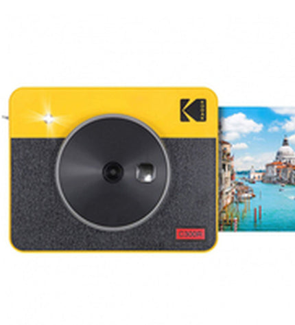 Kodak C300RY digital camera showing front view with lens, display screen, and camera buttons in a well-lit setting.