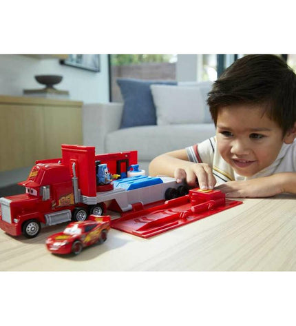 Mattel toy carrier truck from the vehicles and games collection, detailed plastic truck with colorful design and opening trailer.