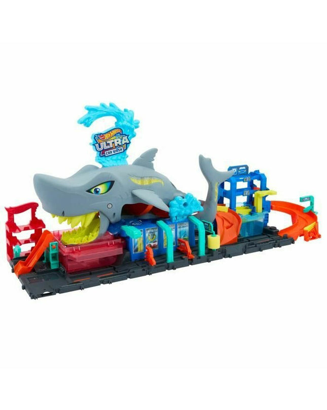 Colorful Mattel race track toy with multiple lanes and racing cars, designed for children to enjoy exciting vehicle races.