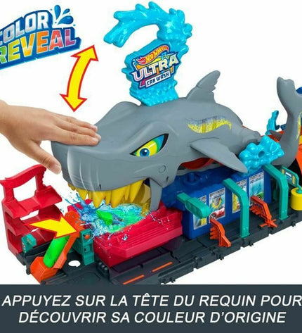Colorful Mattel race track for toys and vehicles, featuring a vibrant racecourse and miniature cars for imaginative play.