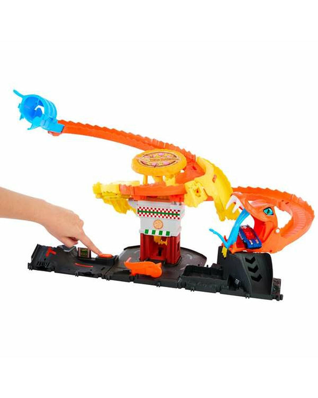 Mattel race track toy with colorful roads and racing cars on a play mat, designed for children’s racing and vehicle play.