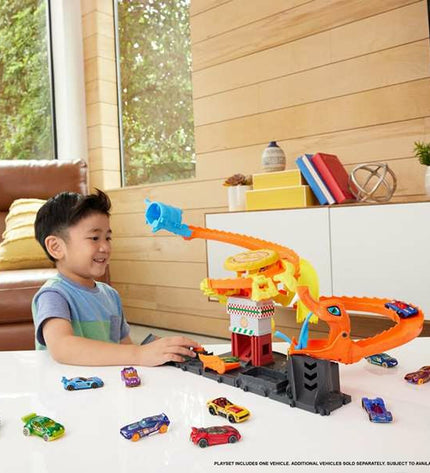 Mattel race track toy for children, featuring colorful racing cars and track pieces for imaginative play.