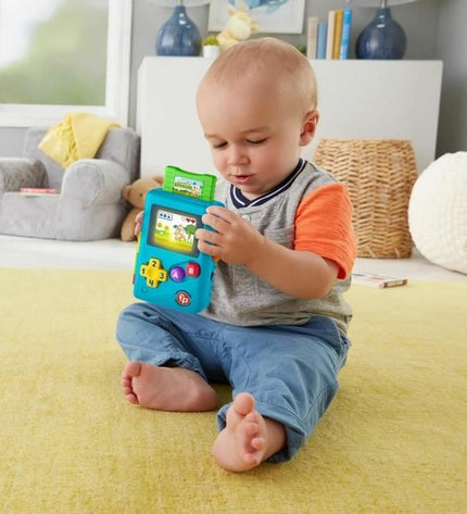 Fisher-Price MY FIRST GAME CONSOLE portable electronic toy with colorful buttons and screen, designed for young children.