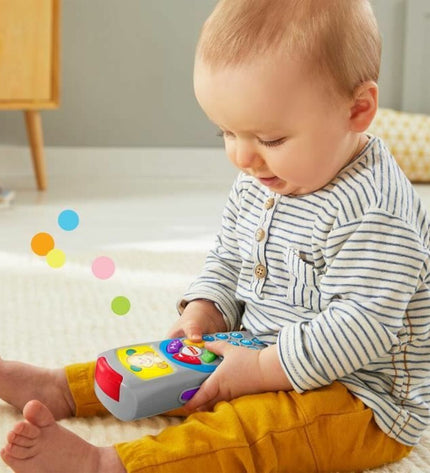 Fisher-Price Laugh and Learn Doggy toy remote for babies, colorful plastic, measuring 10x5x21 cm, designed for young children.