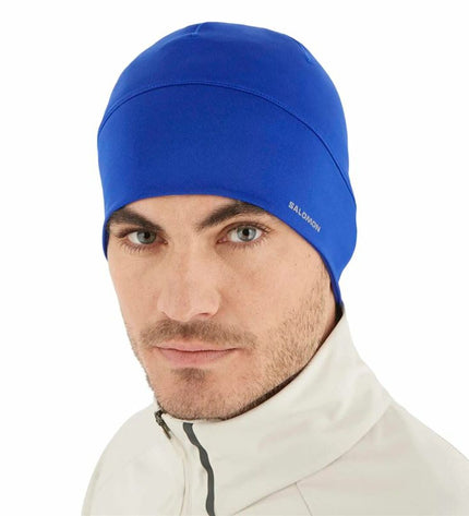 Salomon Active Surf The Web/Reflect blue wetsuit cap for watersport and outdoor activities, designed for comfort and sun protection.