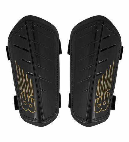 Black New Balance Nclasp Flex football shin guards with adjustable straps, designed for sport and outdoor soccer protection.