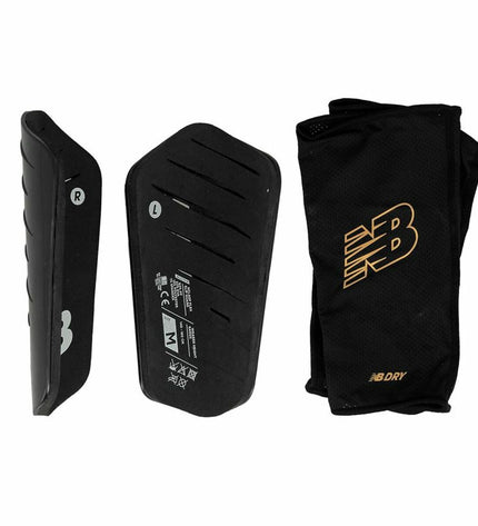 Black New Balance Nclasp Flex soccer shin guards with adjustable straps and protective padding for football players.