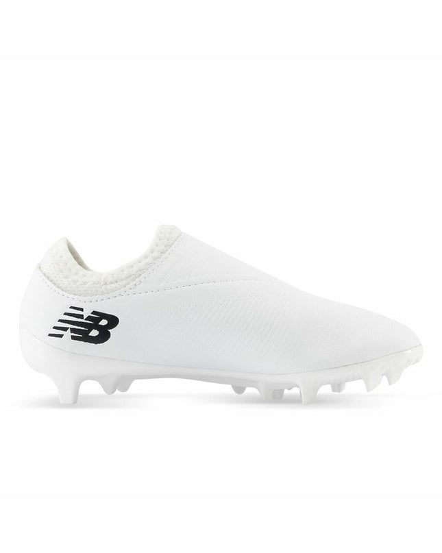 White New Balance Furon Dispatch FG V7+ soccer cleats for kids, designed for outdoor football play.