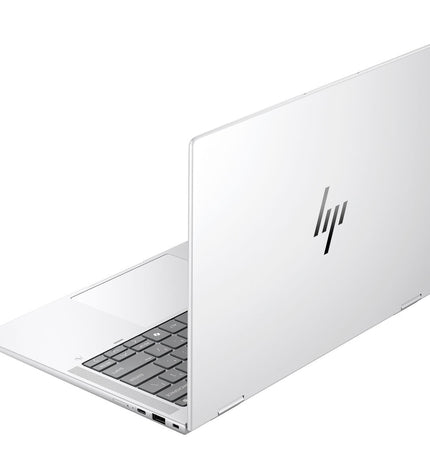 HP B69A3ET 14-inch laptop with Intel Core Ultra 7, 32GB RAM, and 1TB SSD, shown closed with keyboard visible.