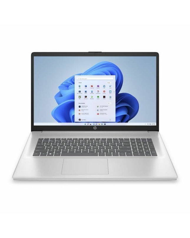 HP laptop for calculation with sleek design and keyboard, showing the HP logo and screen display in a modern workspace.
