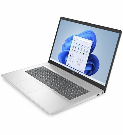HP laptop for calculations, showing a sleek silver design with a keyboard and display screen in a professional workspace.