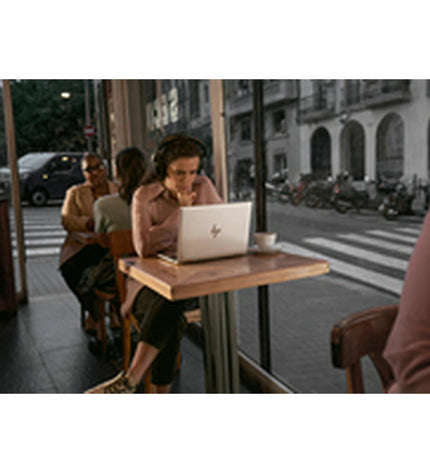 HP AD2Z9ET 13.3-inch laptop with Intel Core i7, 16GB RAM, and 512GB SSD, shown open with keyboard and screen visible.