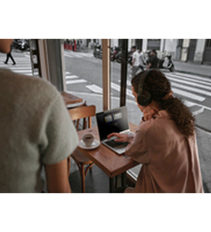 HP AD2Z8ET 13.3-inch laptop with Intel Core Ultra 5 processor, 16GB RAM, and 512GB SSD on a sleek workspace.