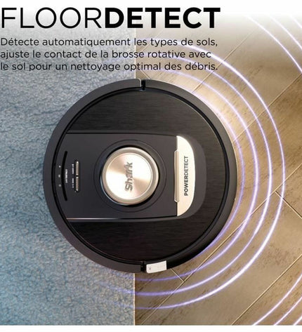 Shark robot stofzuiger on a hardwood floor, showcasing its compact design and cleaning brushes for home floor maintenance.