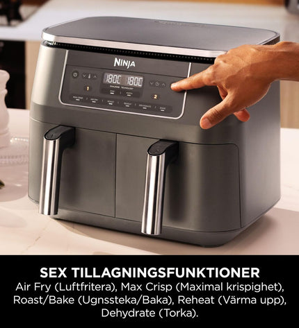 Ninja DZ300EU gray air fryer with 7.6L capacity and 2400W power, shown on a kitchen countertop.