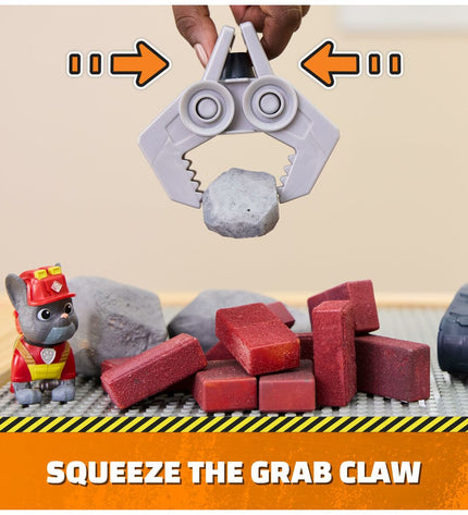 Spin Master Rubble action figure from Paw Patrol toy set, detailed plastic figure in uniform with construction helmet.
