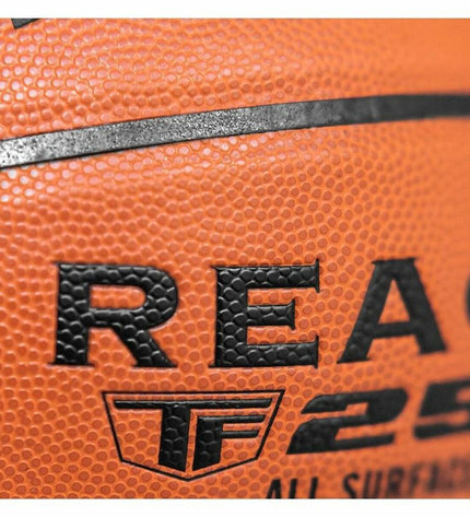 Colorful Spalding React TF-250 basketball with multicolour panels for outdoor sports, shown with close-up of textured surface.