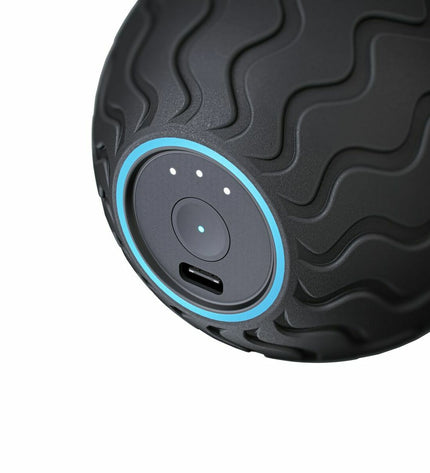 Therabody WAVESOLO-EU black electrostimulation device for health and wellness, showing its compact design and control panel.