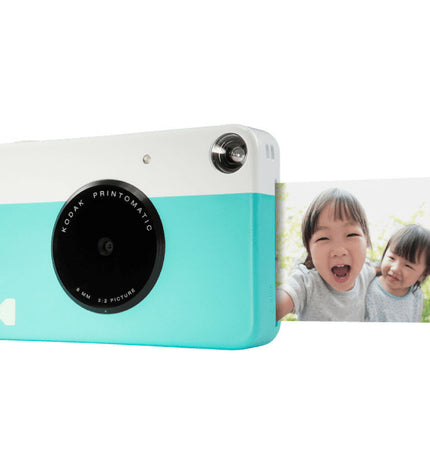 Kodak Printomatic digital camera with compact design, showcasing the camera body and lens for instant photo printing.