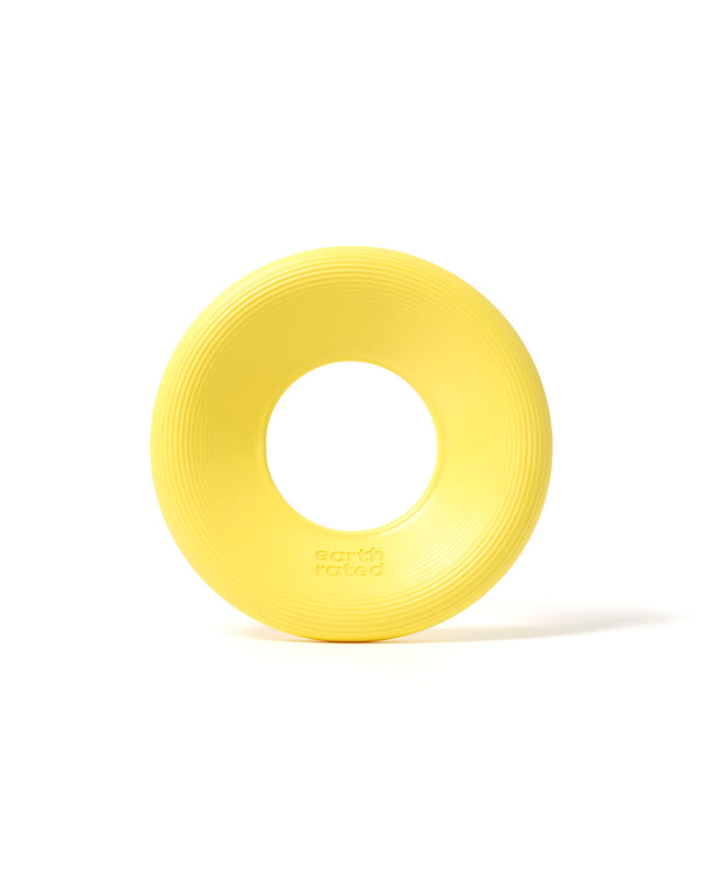 Earth Rated dog toy made of durable rubber, designed for dogs to chew and play with, featuring bright colors and textured surface.