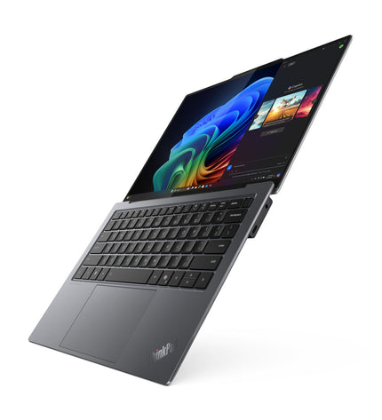Lenovo 14-inch laptop with Intel Core Ultra 7, 32GB RAM, 1TB SSD, QWERTY Spanish keyboard, sleek design, open screen showing keyboard