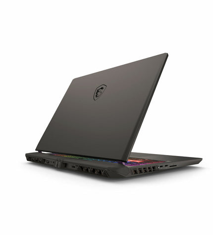 MSI 16-inch gaming laptop with 32GB RAM, 1TB SSD, and RTX 5080 graphics card displayed on a sleek desk setup.