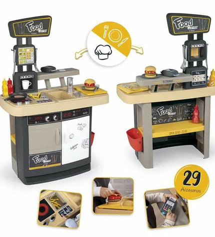 Smoby speelgoedkeuken with realistic stove, sink, and accessories, designed for imaginative play in children.