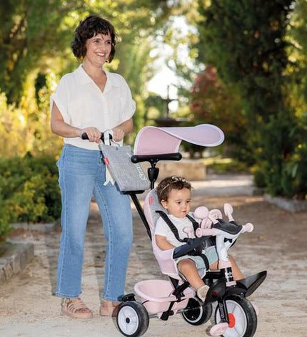 Pink Smoby tricycle for children, suitable for outdoor play and sports, with a sturdy design and colorful features.