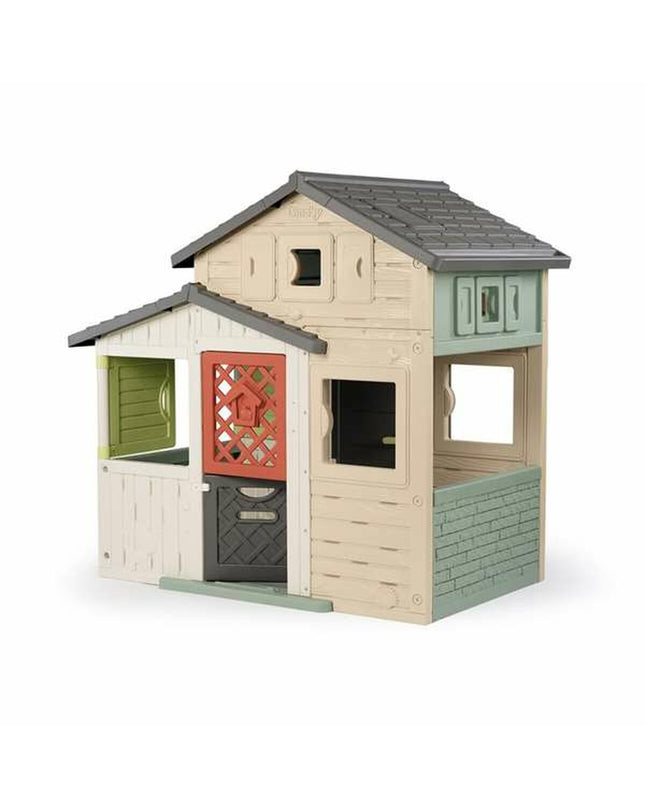 Smoby Evo Friends children’s playhouse in outdoor setting, featuring colorful windows and door, measuring 162 x 164 cm.