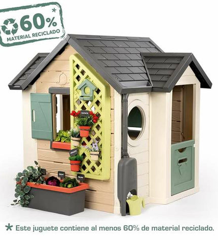 Smoby Life Garden playhouse for children with colorful exterior and open door, ideal for outdoor imaginative play.