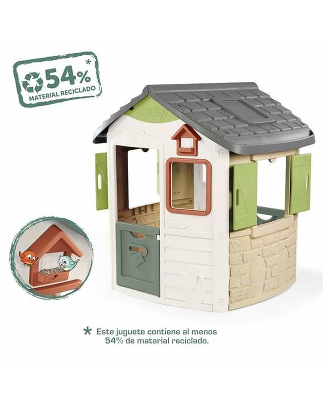 Smoby children's playhouse with colorful exterior, windows, and door, designed for outdoor play and imaginative fun.