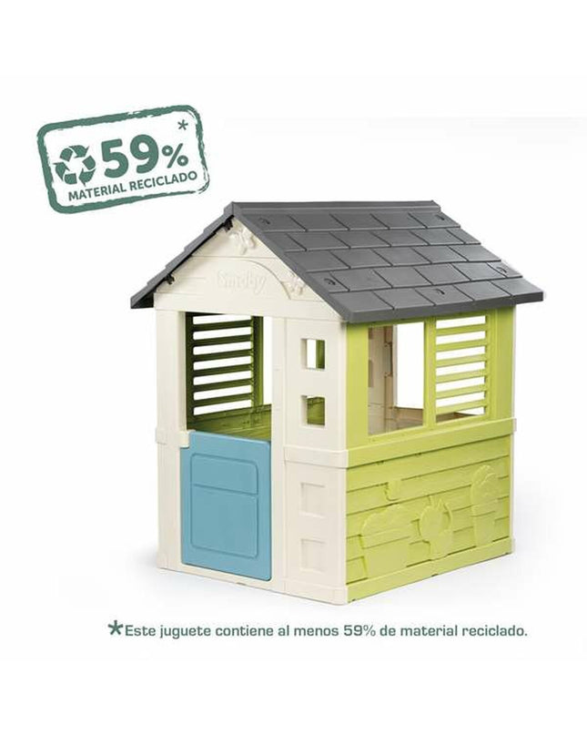 Colorful Smoby Jolie children's playhouse in a garden setting, made of durable plastic for outdoor play and imaginative fun.