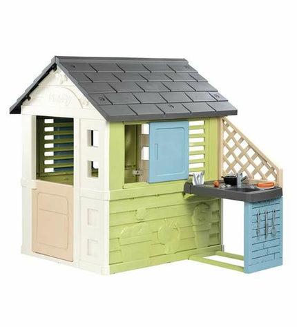 Smoby children's playhouse toy with colorful windows, door, and outdoor design, ideal for outdoor play and imaginative fun.